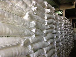 Bags of sugar stacked in stock